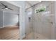 Bathroom featuring glass shower with a view into bedroom at 5703 N 20Th St, Tampa, FL 33610