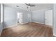 Bright bedroom with a ceiling fan and entryways to a bathroom and closet at 5703 N 20Th St, Tampa, FL 33610