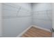 Walk-in closet featuring wire shelving and light wood-look vinyl flooring at 5703 N 20Th St, Tampa, FL 33610