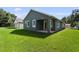 Charming home featuring a well-manicured lawn, neutral paint scheme, and welcoming entryway at 5703 N 20Th St, Tampa, FL 33610