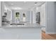 Bright, open kitchen featuring quartz countertops, stainless steel appliances and hardwood floors at 5703 N 20Th St, Tampa, FL 33610