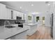Modern kitchen with white cabinets, stainless steel appliances, and a center island at 5703 N 20Th St, Tampa, FL 33610