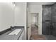 Elegant bathroom with a glass shower enclosure, modern fixtures, and stylish vanity at 5705 N 20Th St, Tampa, FL 33610