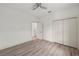 A bright bedroom with a ceiling fan, closet and base trim at 5705 N 20Th St, Tampa, FL 33610
