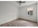 Bedroom with a ceiling fan, base trim, and large window at 5705 N 20Th St, Tampa, FL 33610