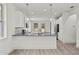 Modern kitchen featuring white cabinets, gray countertops, and stainless steel appliances at 5705 N 20Th St, Tampa, FL 33610