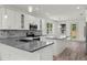 Contemporary kitchen with stainless steel appliances, gray countertops, and abundant natural light at 5705 N 20Th St, Tampa, FL 33610