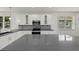 Well-appointed kitchen featuring gray counters, modern stainless steel appliances, and natural light at 5705 N 20Th St, Tampa, FL 33610