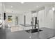 Stylish kitchen featuring stainless steel appliances, white cabinets, and granite counters at 5705 N 20Th St, Tampa, FL 33610