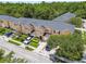 Beautiful aerial view of townhome community with mature trees and well-maintained landscaping at 6234 Ashbury Palms Dr, Tampa, FL 33647