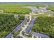An aerial view of the townhome community with ponds, lush greenery, and well-maintained landscaping at 6234 Ashbury Palms Dr, Tampa, FL 33647