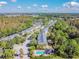 Overhead view of townhomes and the community pool, surrounded by trees, landscaping, and common areas at 6234 Ashbury Palms Dr, Tampa, FL 33647