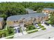 An aerial view shows off the complex's tidy exteriors, landscaping and abundant parking at 6234 Ashbury Palms Dr, Tampa, FL 33647
