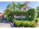 Inviting gated community entrance with lush landscaping and an elegant sign for Emerald Pointe Townhomes at 6234 Ashbury Palms Dr, Tampa, FL 33647