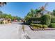 Community entrance featuring stone pillars, lush greenery, and signage for Emerald Pointe Townhomes at 6234 Ashbury Palms Dr, Tampa, FL 33647