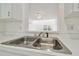 Bright and white kitchen featuring stainless steel sink at 6234 Ashbury Palms Dr, Tampa, FL 33647
