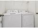 Laundry room features a white washer and dryer at 6234 Ashbury Palms Dr, Tampa, FL 33647