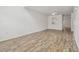 Bright living room with light wood floors and a view into the kitchen at 6234 Ashbury Palms Dr, Tampa, FL 33647