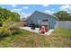 Spacious backyard featuring patio area and playhouse at 7534 Oxford Garden Cir, Apollo Beach, FL 33572