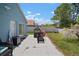 Spacious backyard with patio furniture, playhouse, and lush landscaping at 7534 Oxford Garden Cir, Apollo Beach, FL 33572