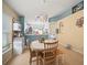Dining room view featuring tile floors, blue and neutral-colored walls and open access to other rooms at 7534 Oxford Garden Cir, Apollo Beach, FL 33572
