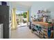 Bright kitchen with stainless steel appliances, white cabinets, and sliding glass doors to the backyard at 7534 Oxford Garden Cir, Apollo Beach, FL 33572