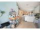 Bright kitchen with white cabinets, stainless steel appliances, and eat-in bar overlooking the Gathering room at 7534 Oxford Garden Cir, Apollo Beach, FL 33572
