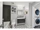 Sleek bathroom with modern fixtures, including a stylish vanity, toilet, and bathtub, plus washer and dryer at 777 N Ashley Dr # 2510, Tampa, FL 33602