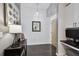 Hallway entrance with dark wood floors, artful decor and desk area at 777 N Ashley Dr # 2510, Tampa, FL 33602