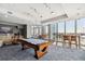Community game room with pool table, TV, and seating offers great views and entertainment at 777 N Ashley Dr # 2510, Tampa, FL 33602