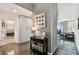 Entry hallway leading to bathroom, kitchen, and living area with dark wood floors at 777 N Ashley Dr # 2510, Tampa, FL 33602