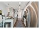Stylish kitchen with stainless steel appliances, white cabinets and long runner rug at 777 N Ashley Dr # 2510, Tampa, FL 33602
