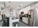 Bright kitchen with white cabinets, stainless steel appliances, and breakfast bar seating at 777 N Ashley Dr # 2510, Tampa, FL 33602