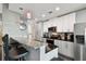 Bright kitchen with white cabinets, stainless steel appliances, and breakfast bar at 777 N Ashley Dr # 2510, Tampa, FL 33602