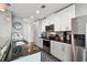 Bright kitchen with white cabinets, stainless steel appliances, and dark countertops at 777 N Ashley Dr # 2510, Tampa, FL 33602