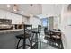 Modern interior design of kitchen and living area featuring dark wood floors and city views at 777 N Ashley Dr # 2510, Tampa, FL 33602
