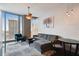 Comfortable living room with cityscape view, ceiling fan, and neutral color palette at 777 N Ashley Dr # 2510, Tampa, FL 33602