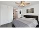 Cozy bedroom with a ceiling fan, a comfortable bed, and a view of the closet area with washer and dryer at 777 N Ashley Dr # 2510, Tampa, FL 33602
