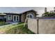 Backyard with an above ground pool and view of the home's exterior at 8330 Lafitte Dr, Hudson, FL 34667