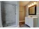 Clean bathroom featuring a walk-in shower and a white vanity at 8330 Lafitte Dr, Hudson, FL 34667