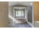 Bathroom featuring a large tub, a walk-in shower, and wood-look flooring at 8330 Lafitte Dr, Hudson, FL 34667