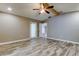 This bedroom offers neutral paint, wood-look flooring, and great lighting at 8330 Lafitte Dr, Hudson, FL 34667