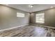 Neutral bedroom with wood-look flooring and plenty of natural light at 8330 Lafitte Dr, Hudson, FL 34667