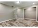 This bedroom features a neutral color palette, wood-look flooring, and a walk-in closet at 8330 Lafitte Dr, Hudson, FL 34667