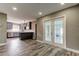 This dining area features wood-look floors and French doors to the lanai at 8330 Lafitte Dr, Hudson, FL 34667