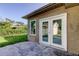 Exterior view of the home, featuring french doors, and a window at 8330 Lafitte Dr, Hudson, FL 34667