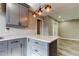 This kitchen features gray cabinets, white countertops, and modern lighting at 8330 Lafitte Dr, Hudson, FL 34667