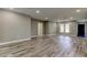 Large open living room with new floors and recessed lighting at 8330 Lafitte Dr, Hudson, FL 34667