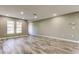 Spacious living room with wood-look floors and recessed lighting at 8330 Lafitte Dr, Hudson, FL 34667