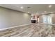 This living room offers an open floor plan with updated flooring and recessed lighting at 8330 Lafitte Dr, Hudson, FL 34667